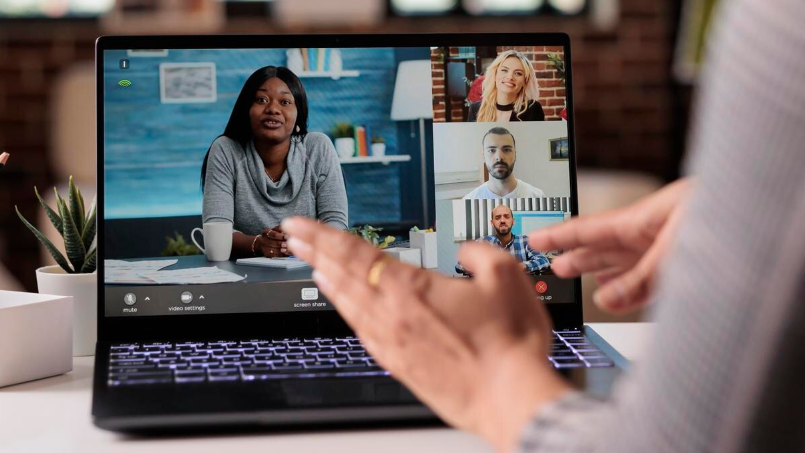 Video call among five professionals, illustrating how a growing practice uses Fiber optic Internet to support collaboration.