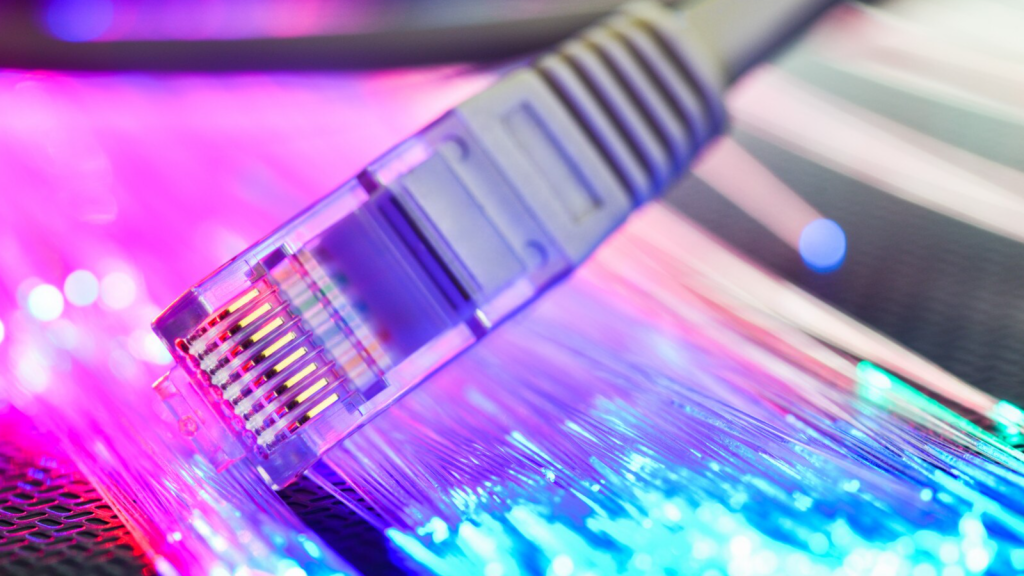 Close-up of Ethernet cable with glowing lights, representing fast and secure business internet Sugar Land connectivity infrastructure.