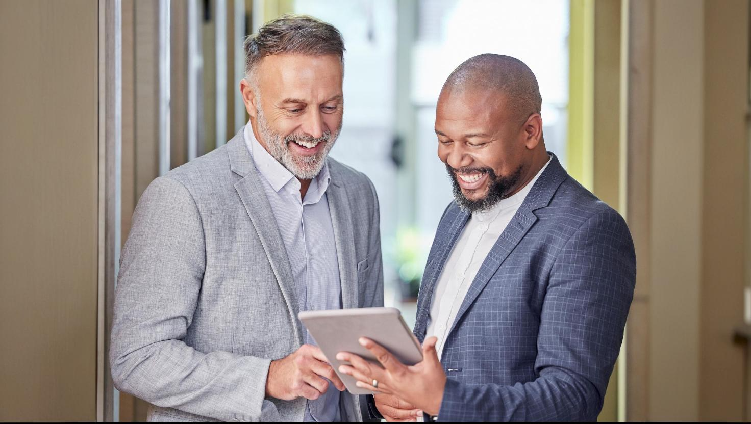 Service provider and customer talking happily during initial consultation–showing PS Lightwave customer service.