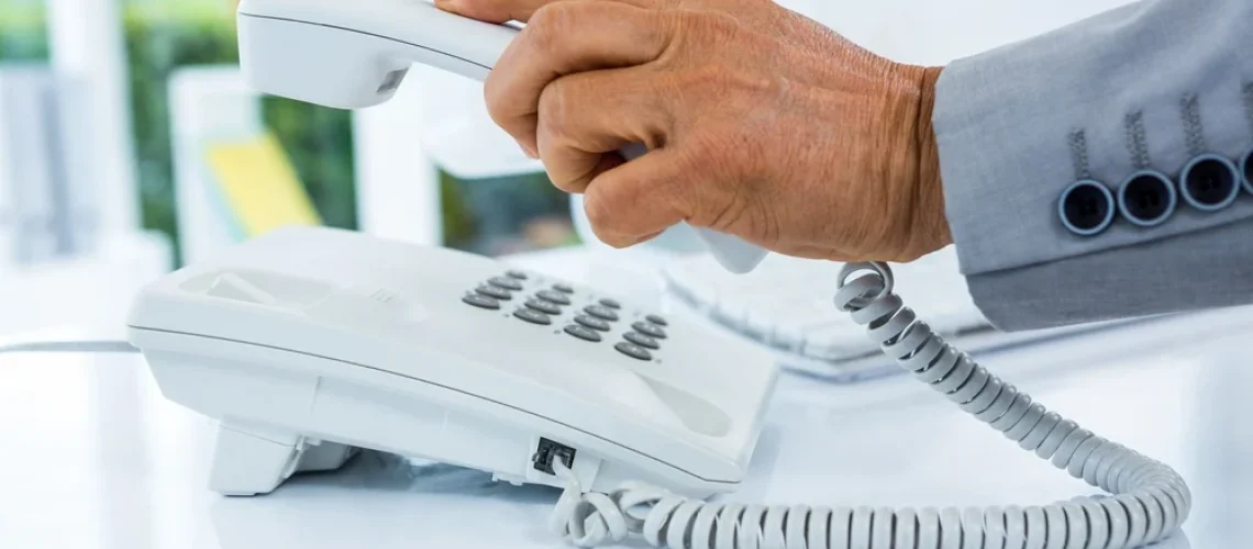 Businessman-answering-the-phone-in-an-office
