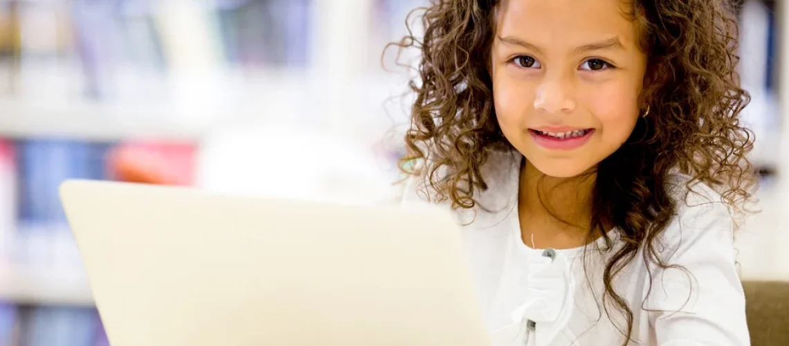 Girl-using-a-laptop-computer-at-school